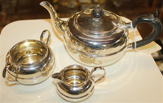 Silver three-piece tea service, circular banded form